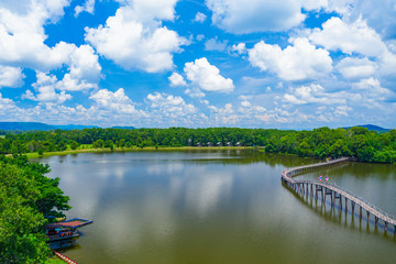 Aerial view of wood bridge cross the river and blusky with cloud in Chumphon province.