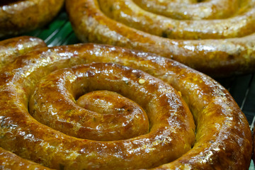 Northern Thai sausage or Sai Sua, consisting of many spices, herbs, lemongrass, galangal, kaffir lime, coriander and curry paste.