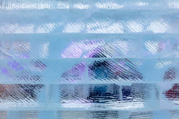 Ice bricks backlit in blue as a background