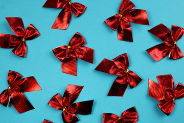 background red bows on a blue background texture