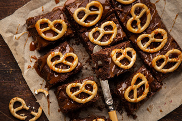 Chocolate brownies with nuts, salted caramel and pretzels