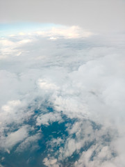Sunrise above clouds from airplane window. Bright blue sky top horizontal view copyspace. Travelling concept View of the engine.