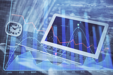 Financial graph colorful drawing and table with computer on background. Double exposure. Concept of international markets.