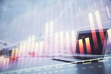 Forex graph hologram on table with computer background. Multi exposure. Concept of financial markets.