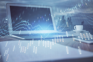 Forex Chart hologram on table with computer background. Double exposure. Concept of financial markets.