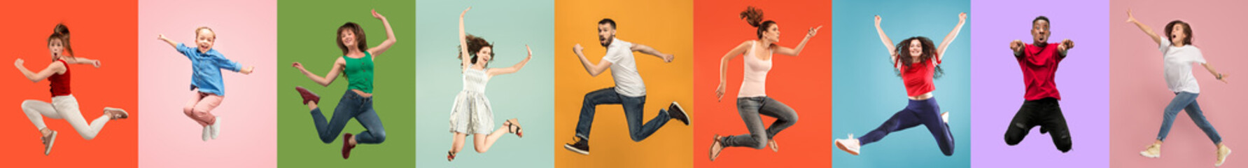 Young emotional people on multicolored backgrounds. Young surprised women jumping happy. Human...