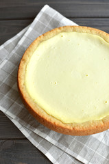 homemade cottage cheese pie on check gray flax napkin background