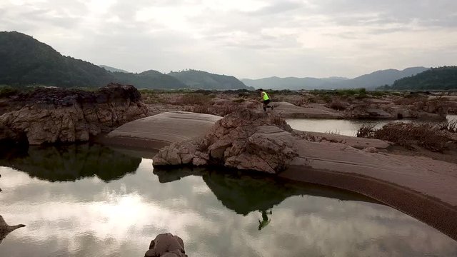 Aerial view the trail runner of man  in the Mekong river