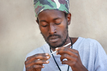 Rasta preparing a joint