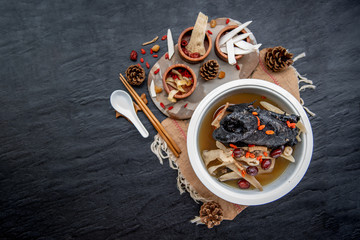 Chinese traditional nourishing health stew, stewed black bone chicken, Chinese black chicken soup,...