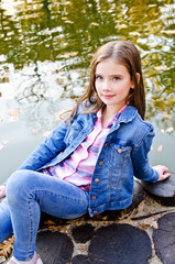 Obraz premium Outdoors portrait of adorable smiling little girl child