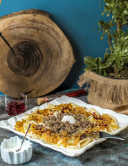 azerbaijani khangal thinly cutted dough topped with minced meat and caramelized onion 1
