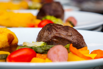french dish breaded beef with vegetables and potatoes
