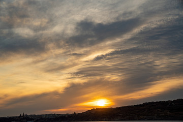 Fototapeta na wymiar Sunset over mediterranean sea Beautiful cloudscape over the sea, sunrise / sunset shot.