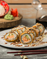 fried sushi rolls with salmon and cucumber