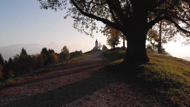 Autumn aerial view of a beautiful church on the top of a hill, in Slovenia
