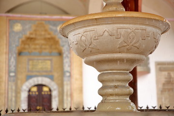 Close-up on the fountain (Sadrvan) located in the courtyard of Gazi Husrev Begova Mosque, with the...