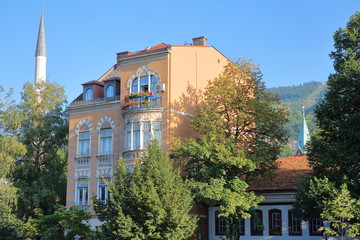 Traditional and colorful facades with carvings, located on the left bank of the Miljacka river,...