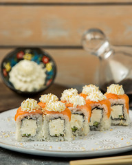 philadelphia sushi rolls cucumber and covered with salmon