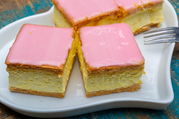 Tompoes or tompouce, iconic pastry in Netherlands and Belgium made from puff dough, icing, cream
