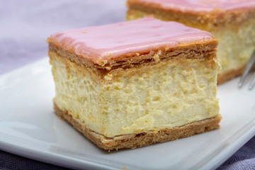 Tompoes or tompouce, iconic pastry in Netherlands and Belgium made from puff dough, icing, cream