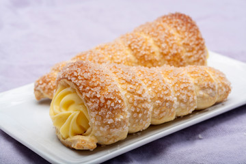 Filled with yellow cream homemade horn pastry