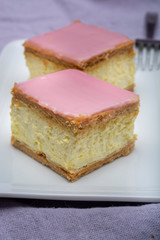 Tompoes or tompouce, iconic pastry in Netherlands and Belgium made from puff dough, icing, cream