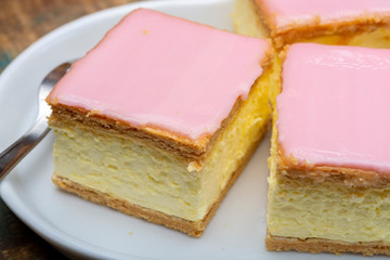 Tompoes or tompouce, iconic pastry in Netherlands and Belgium made from puff dough, icing, cream
