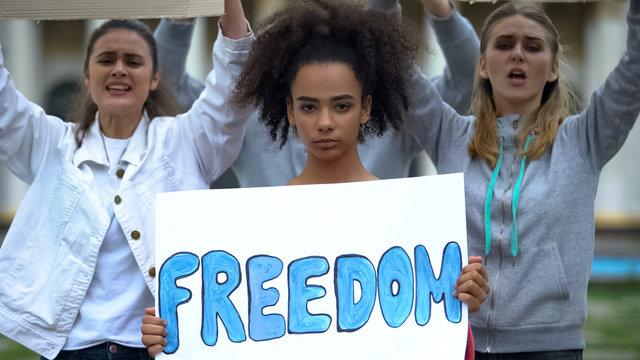 Crowd with banners standing for freedom of religion speech, democratic choice