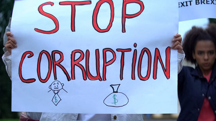 People with slogan Stop corruption protesting government, for political reform