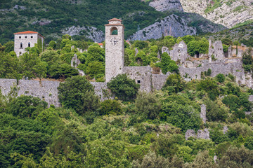 Fototapeta na wymiar Clock tower and ruins of citadel in Stari Bar town near Bar city, Montenegro