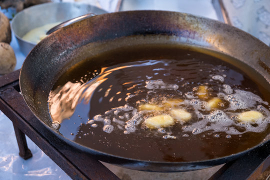 Typical Sardinian fried cheese made with "Seadas" cheese.Traditional Sardinian cheese during cooking.