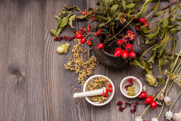 Halloween concept background. Witch bowler, mistletoe, elderberry. Dry herbs, flowers, fresh berries