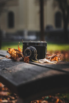 Vintage smena camera on a bench at autumn