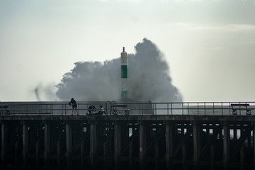 Strong winds create big waves that batter into Aberystwyth, Mid Wales sea front during the Storm season.