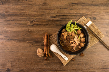 Hot and Spicy Nam Tok noodles soup with meat balls.Thai boat noodles is Street food of Thailand style, that famous noodles soup,
