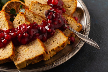 Delicious chicken and pork pate in Christmas decoration. Rustic style. Dark background, metal plates. Front view.