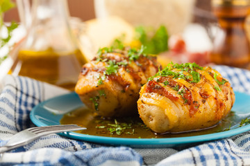 Baked potatoes in Swedish. Hasselback. Stuffed with cheese and bacon. Top view.