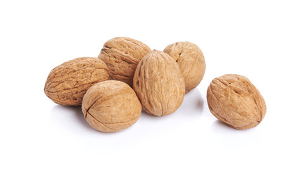 Heap of walnuts isolated on white background