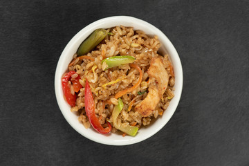 japanese cuisine rice with chicken in a bowl. Top view