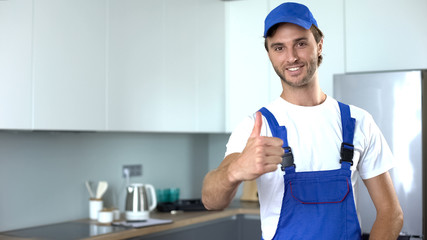 Professional handyworker showing thumbs up, ad of high-quality home repairs
