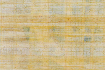 Fototapeta na wymiar Texture of yellow natural old papyrus paper background