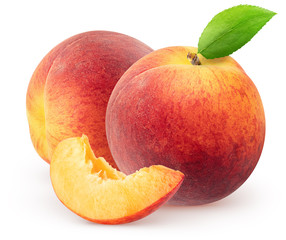 Isolated peaches. Two whole peach fruits with leaf and piece isolated on white background, with clipping path