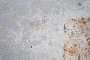 Gray rusty metal surface with peeling paint