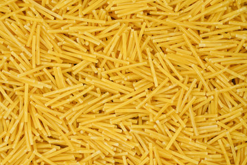 small pasta texture background closeup. vermicelli.  raw small noodles