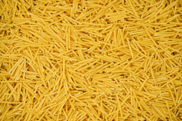 small pasta texture background closeup. vermicelli.  raw small noodles