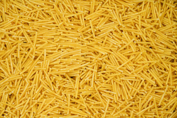 small pasta texture background closeup. vermicelli.  raw small noodles