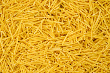 small pasta texture background closeup. vermicelli.  raw small noodles