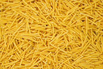 small pasta texture background closeup. vermicelli.  raw small noodles