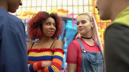 Attractive high school students looking each other, flirting male classmates